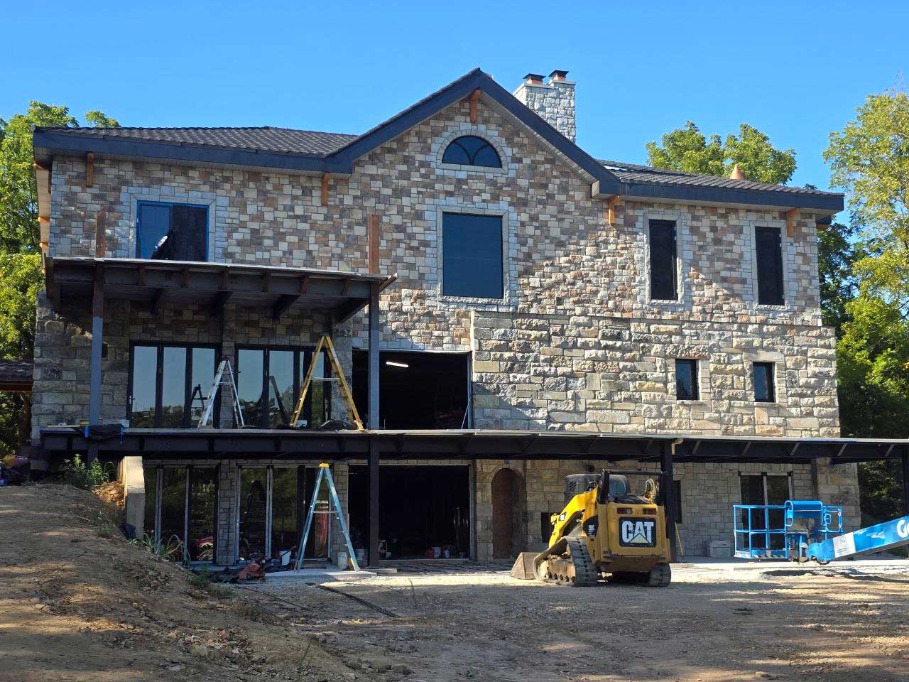 Dedicated Builders seamless gutter and roof work on an El Dorado Springs MO home